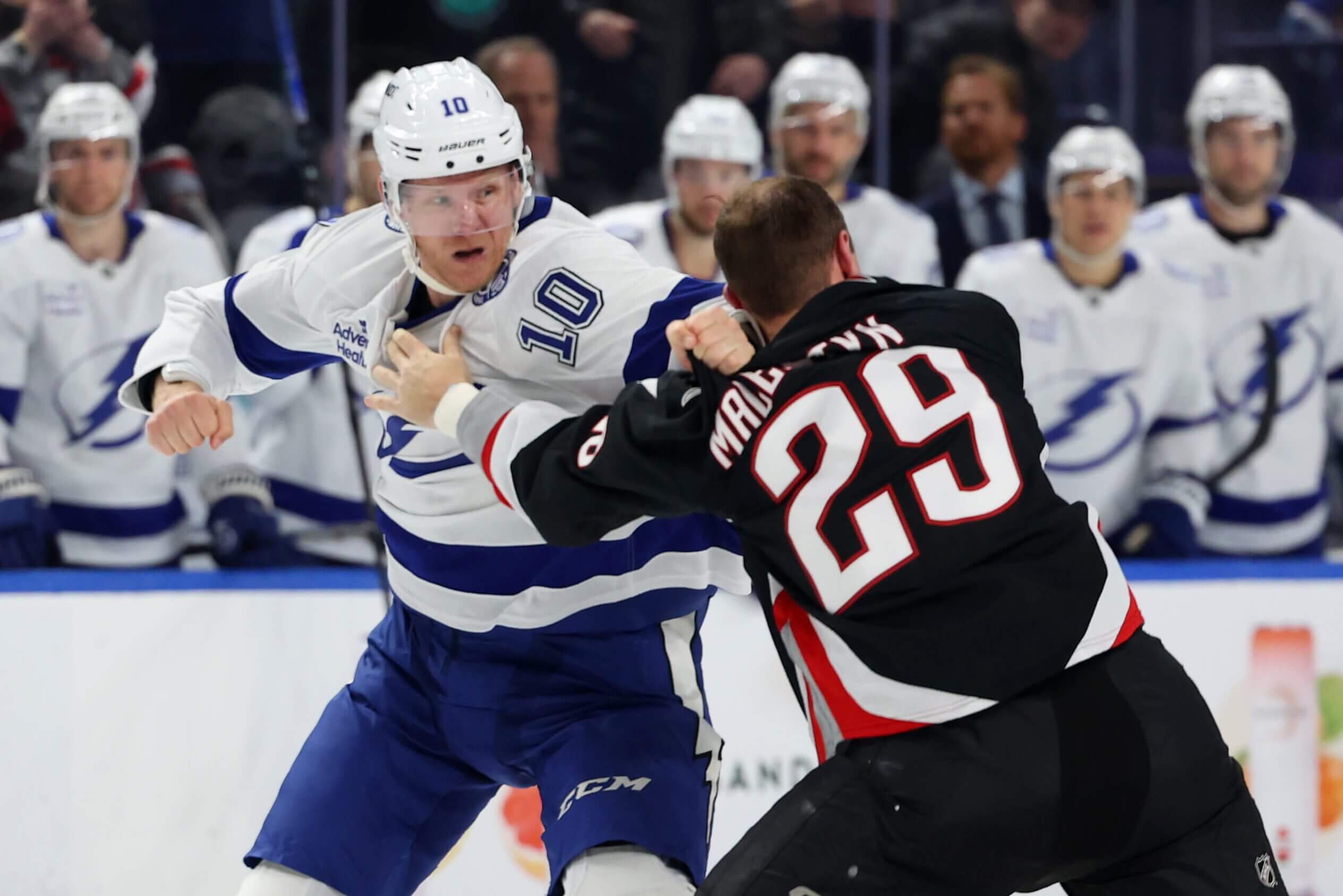 Tampa Bay's Corey Perry and Buffalo's Beck Malenstyn fight.