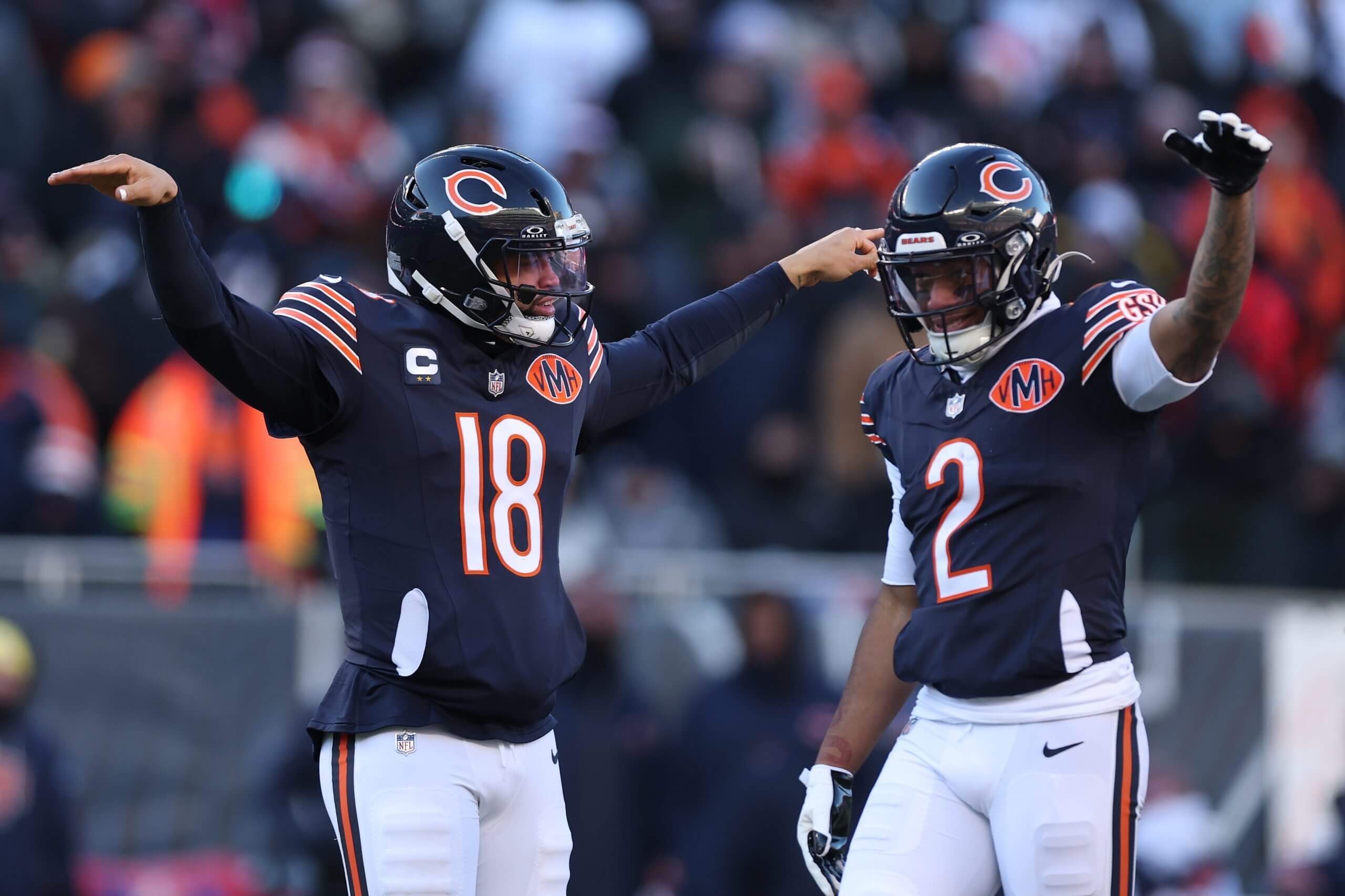 CHICAGO, ILLINOIS - DECEMBER 14: Caleb Williams #18 and DJ Moore #2 of the Chicago Bears react after the play during the third quarter against the Cleveland Browns at Soldier Field on December 14, 2025 in Chicago, Illinois. 