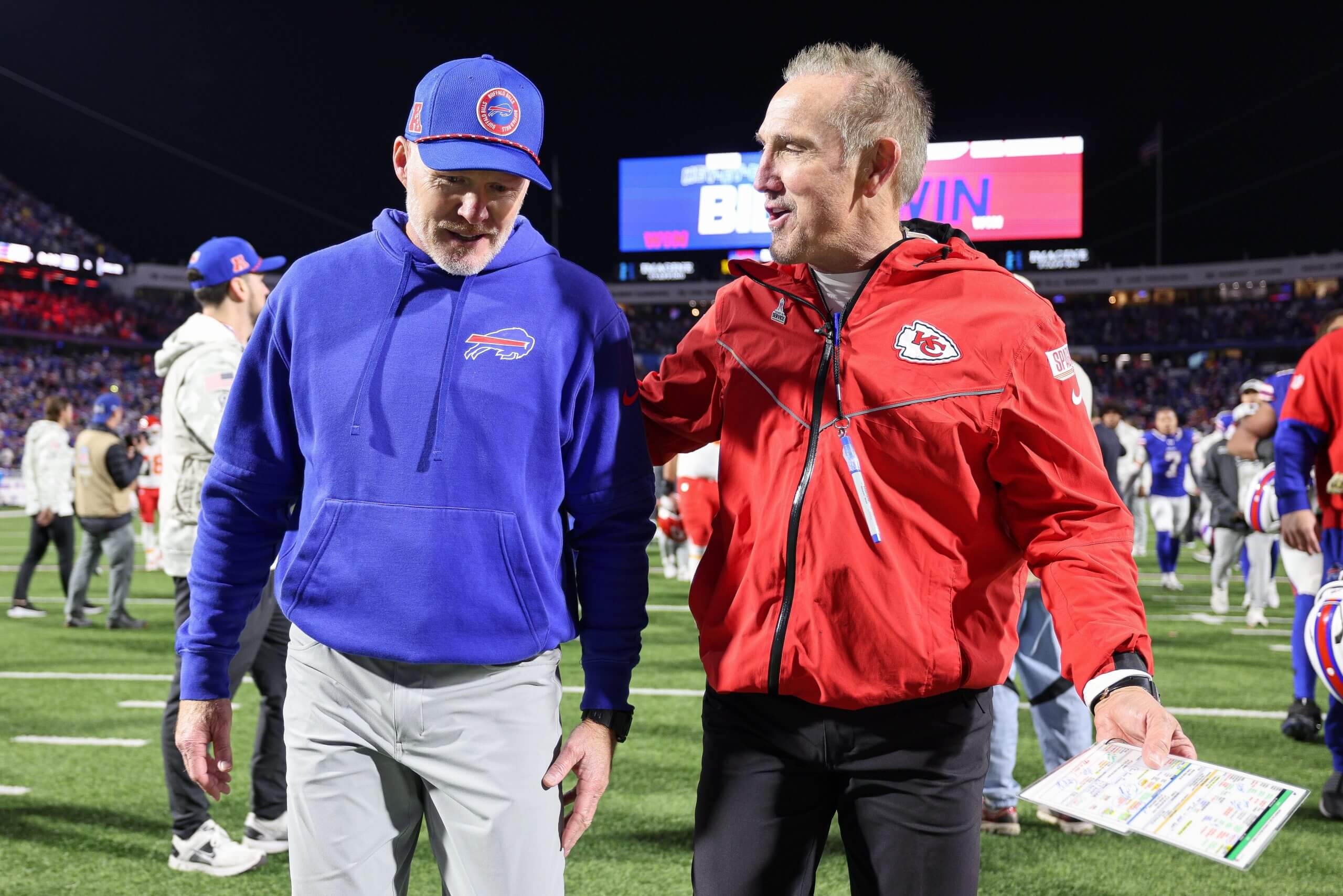 Head Coach Sean McDermott of the Buffalo Bills and defensive coordinator Steve Spagnuolo of the Kansas City Chiefs talk after a game at Highmark Stadium.