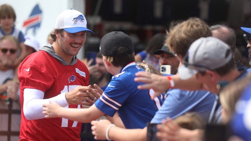 Bills Quarterback Josh Allen gives high-fives to fans as he circles the stadium at the end of Bills training camp at St. John Fisher University in Pittsford, NY on August 8, 2024. Today was the last day at St. John Fisher.