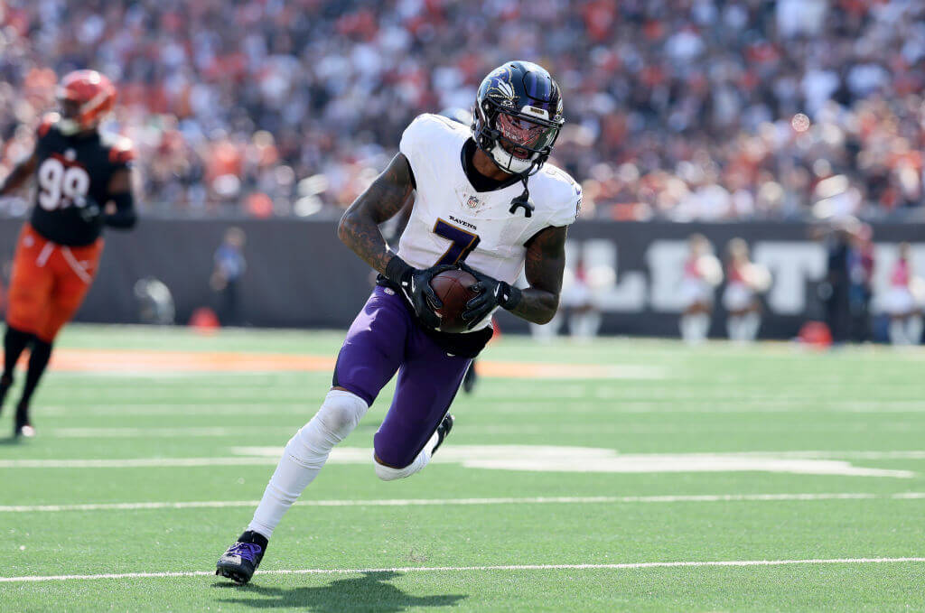 Rashod Bateman runs with the football Rashod Bateman runs with the football